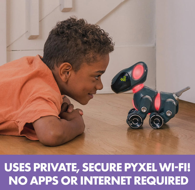 A child is laying on the ground face to face with the Pyxel coding pet. The words "uses private, secure Pyxel wi-fi! No apps or internet required" is displayed at the bottom. 