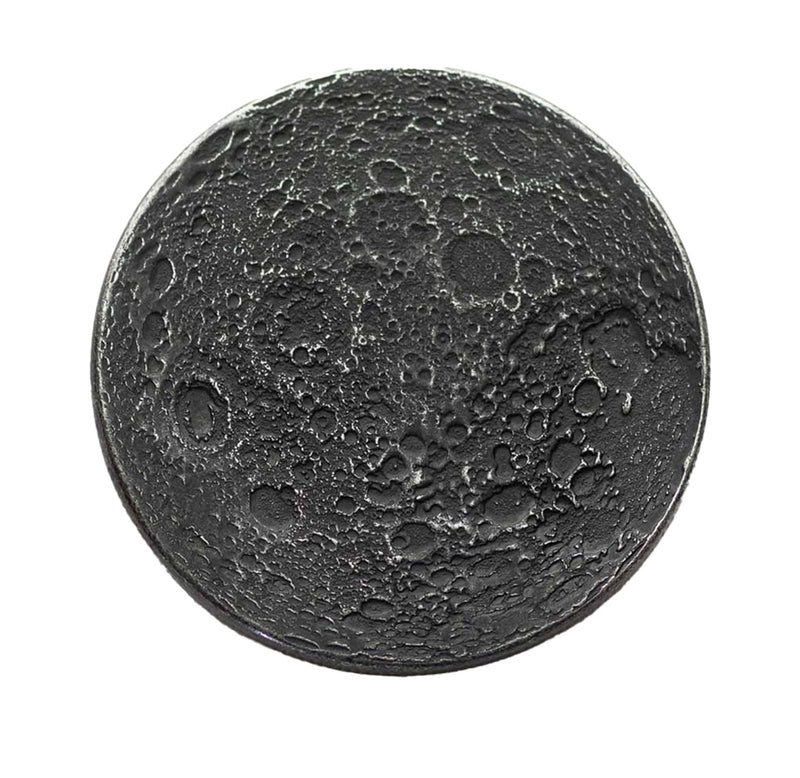 A round iron-colored coin that looks like a crater-filled side of the moon. 