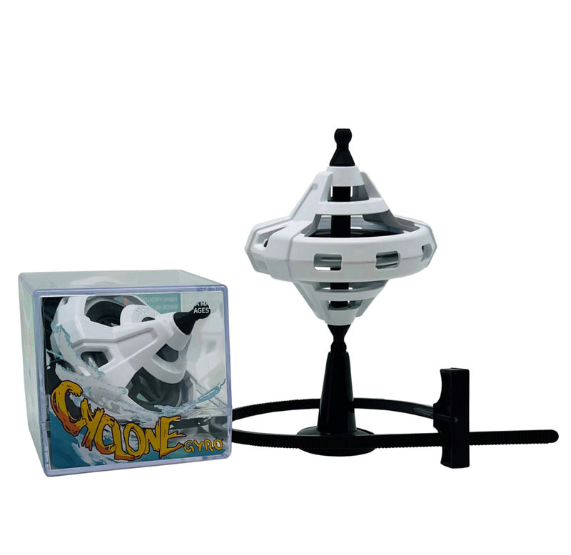 The gyroscope is pictured on top of the black stand, a black pull tab, and a box with another gyroscope on it. 