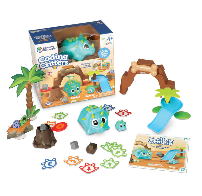 The coding critters box packaging with all the components laid out around it including various environmental props, an arch, a slide, cards with arrows on them, an instruction booklet, and the two dinosaurs. 